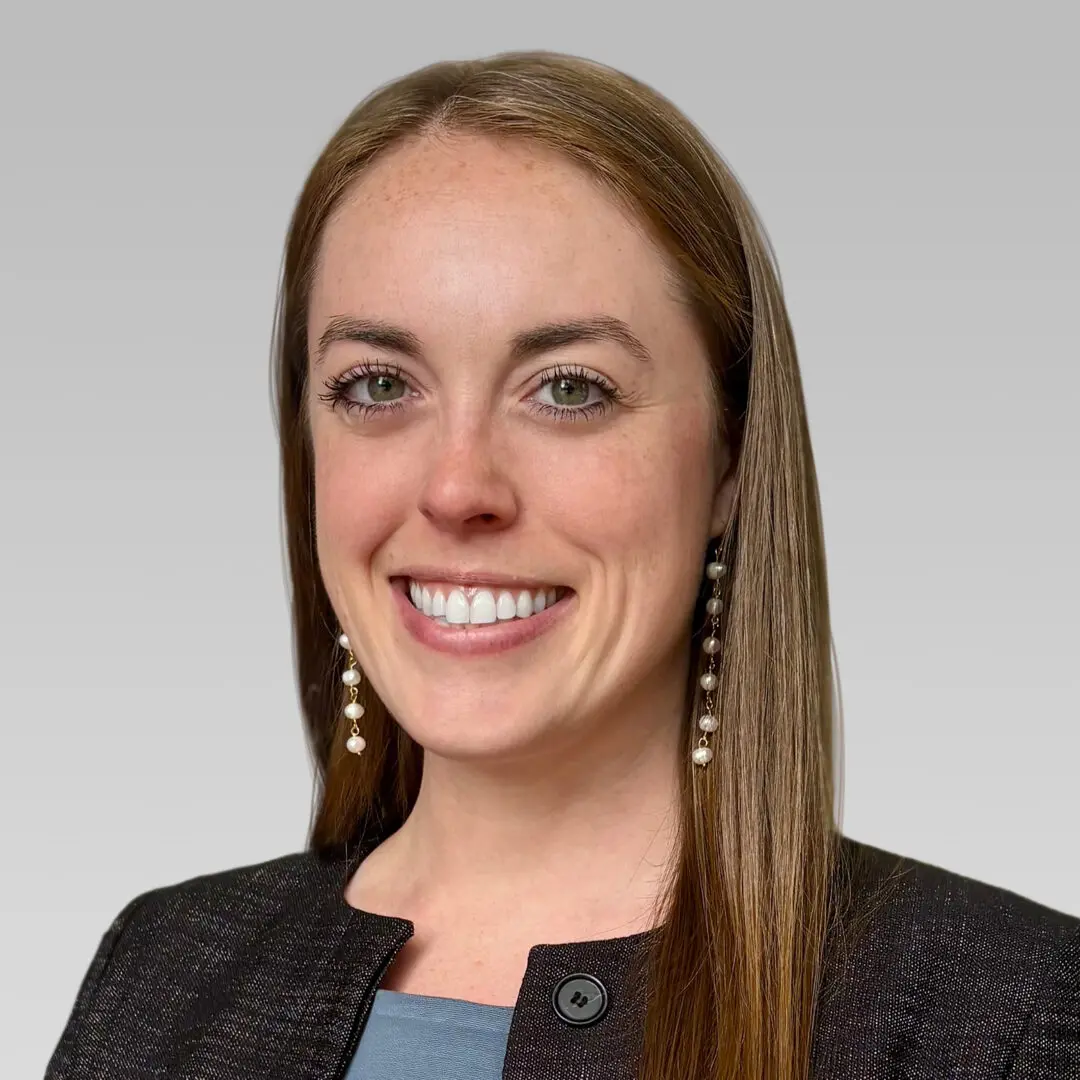 Professional woman smiling in a business portrait.